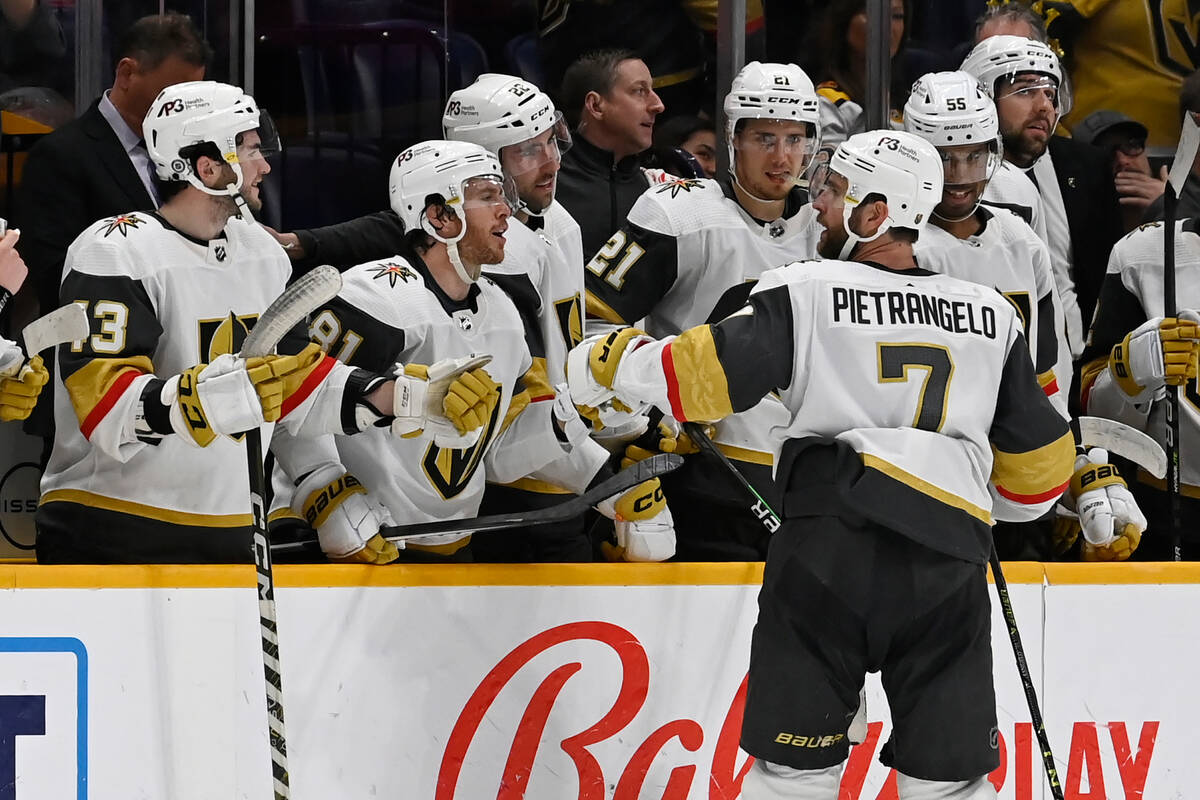 Vegas Golden Knights defenseman Alex Pietrangelo (7) is congratulated after scoring an empty-ne ...