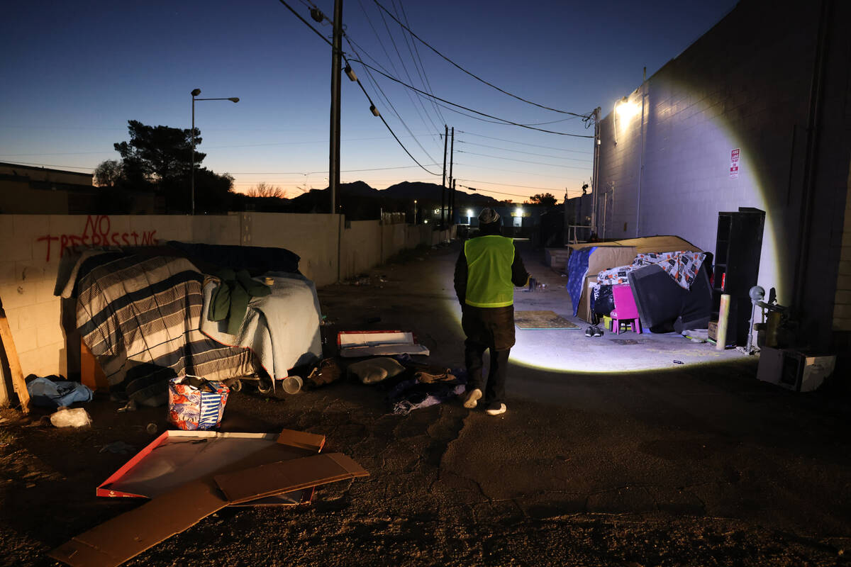 Pastor Phillip Washington looks for unsheltered individuals near Civic Center Drive and Mary De ...