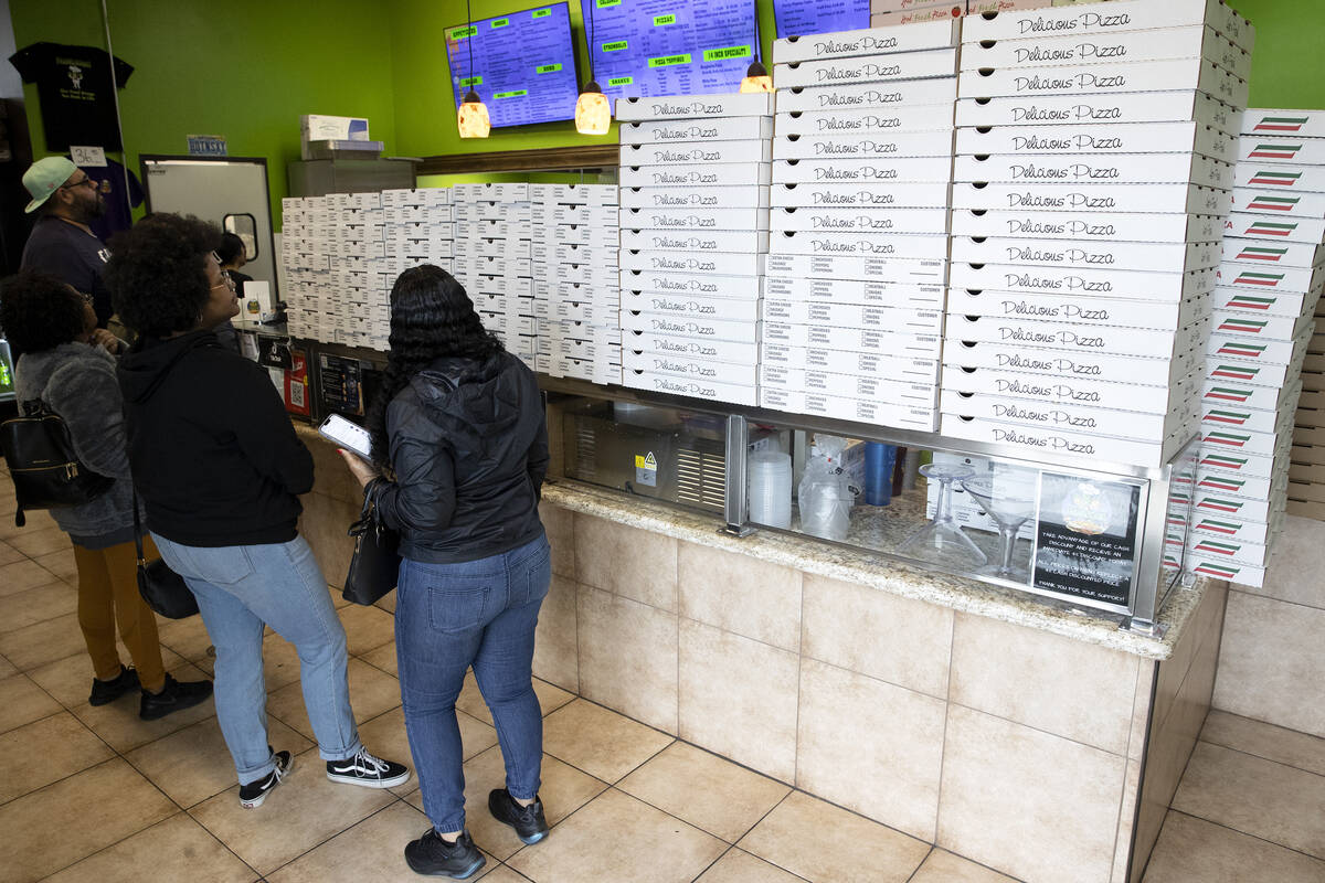 Customers wait in line at Frankensons pizzeria on Friday, Feb. 24, 2023, in Las Vegas. Frankens ...