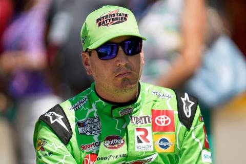 FILE - Kyle Busch watches during NASCAR Cup Series auto race qualifying at the Michigan Interna ...