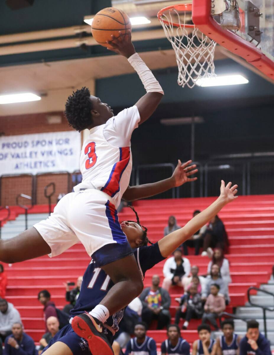 Valley's Elijah Flowers (3) lays up the ball against Legacy's Ja'Merion Brass (11) during the f ...