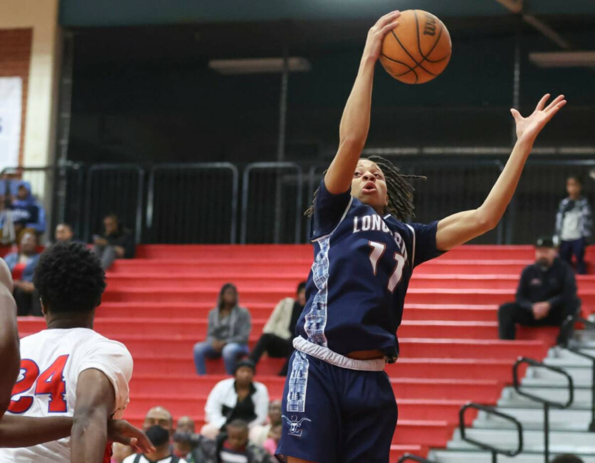 Legacy's Ja'Merion Brass (11) grabs the rebound during the first half a basketball game at Vall ...