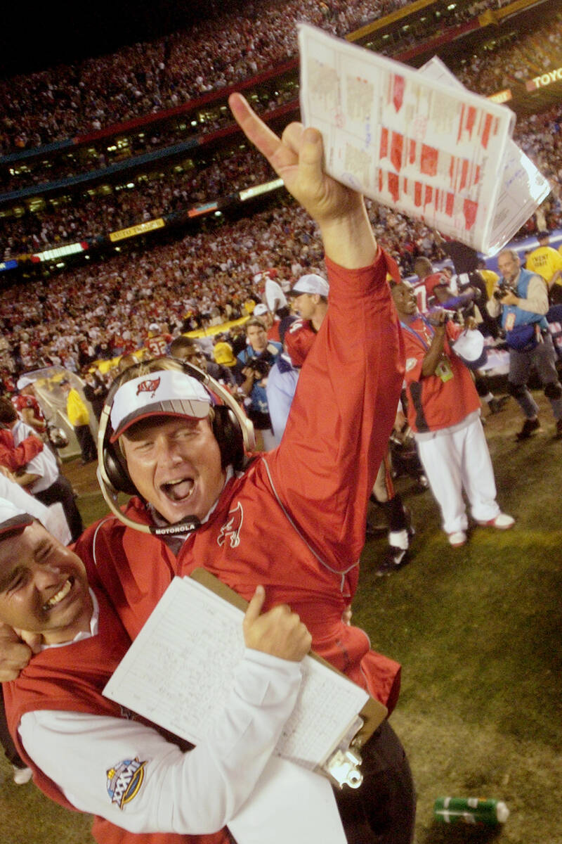 Tampa Bay Buccaneers head coach Jon Gruden gestures the number 1 as he celebrates on the sideli ...