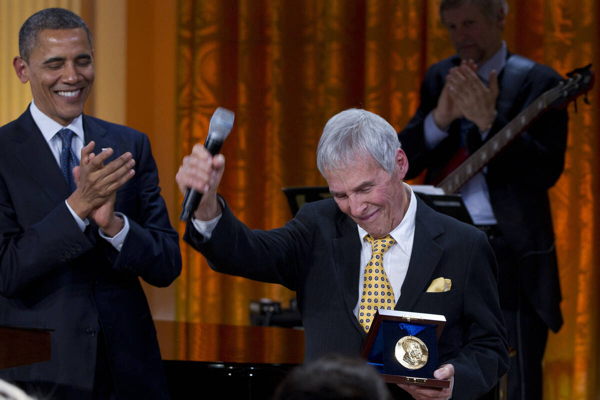 President Barack Obama applauds after presenting songwriter Burt Bacharach with a 2012 Library ...