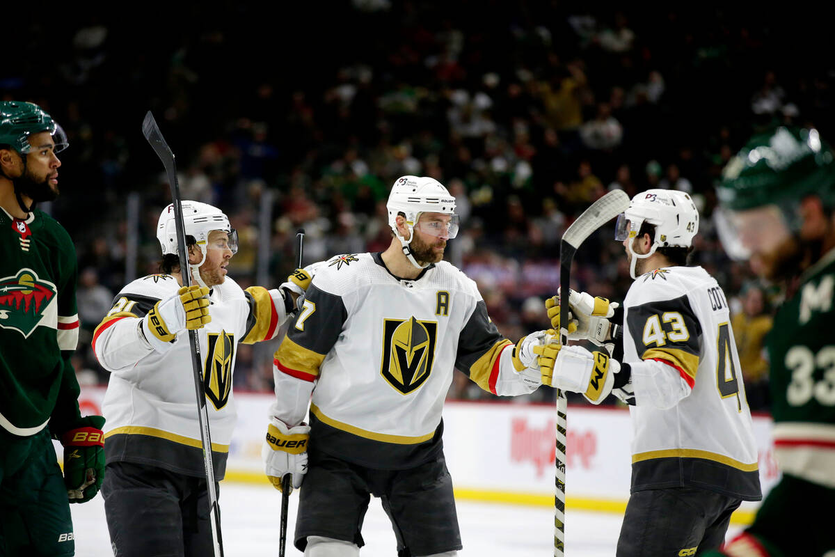 Vegas Golden Knights defenseman Alex Pietrangelo (7) is congratulated by teammates Jonathan Mar ...