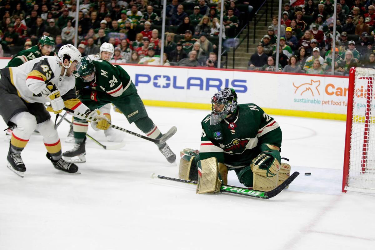 Vegas Golden Knights center Paul Cotter (43) scores a goal on Minnesota Wild goaltender Marc-An ...