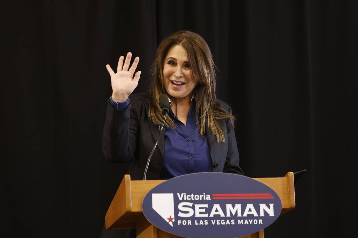 Las Vegas Councilwoman Victoria Seaman waves during a news conference to announce her bid to be ...