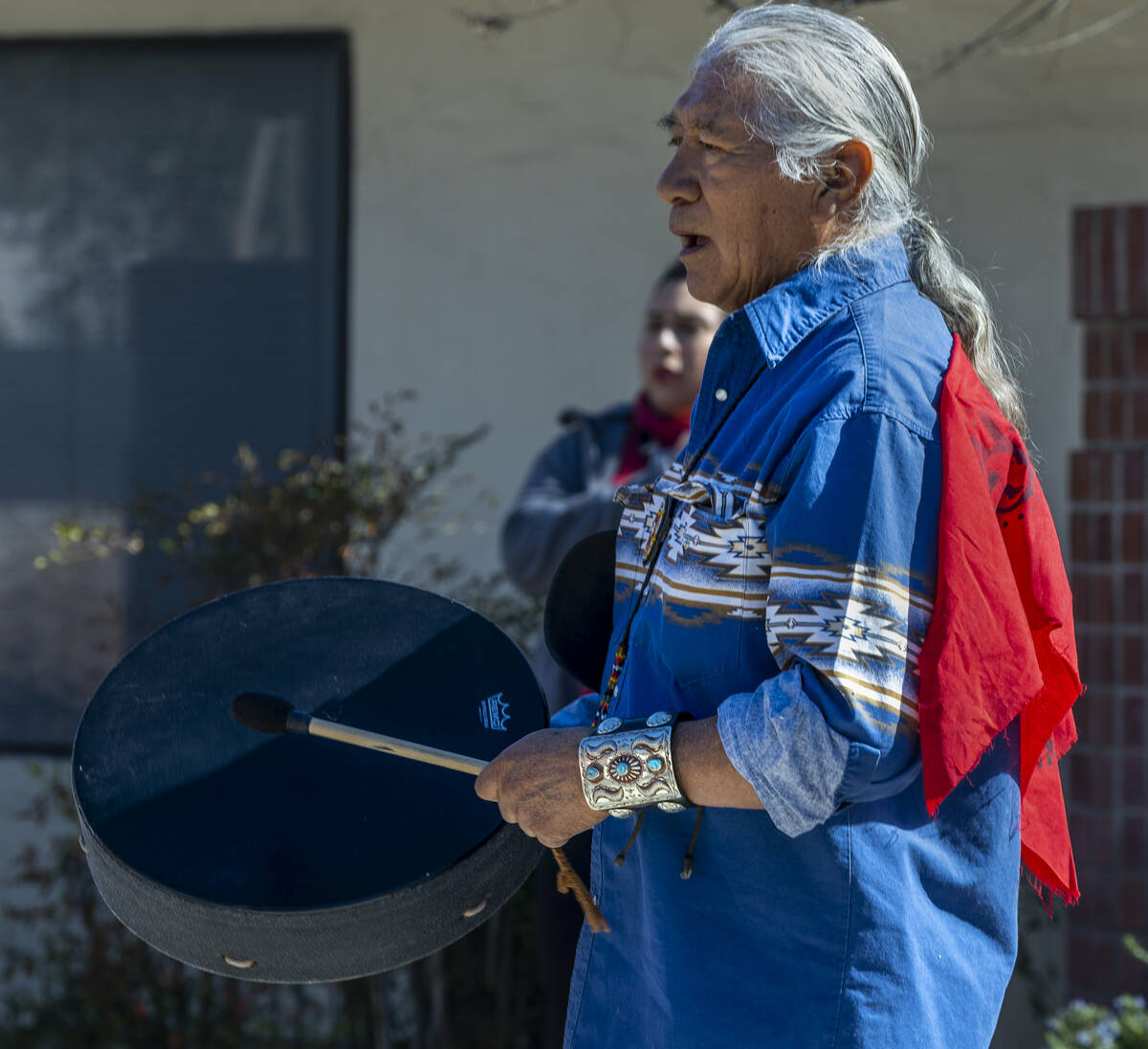 Johnnie Bobb, chief of the Western Shoshone National Council, performs a drum song as members o ...