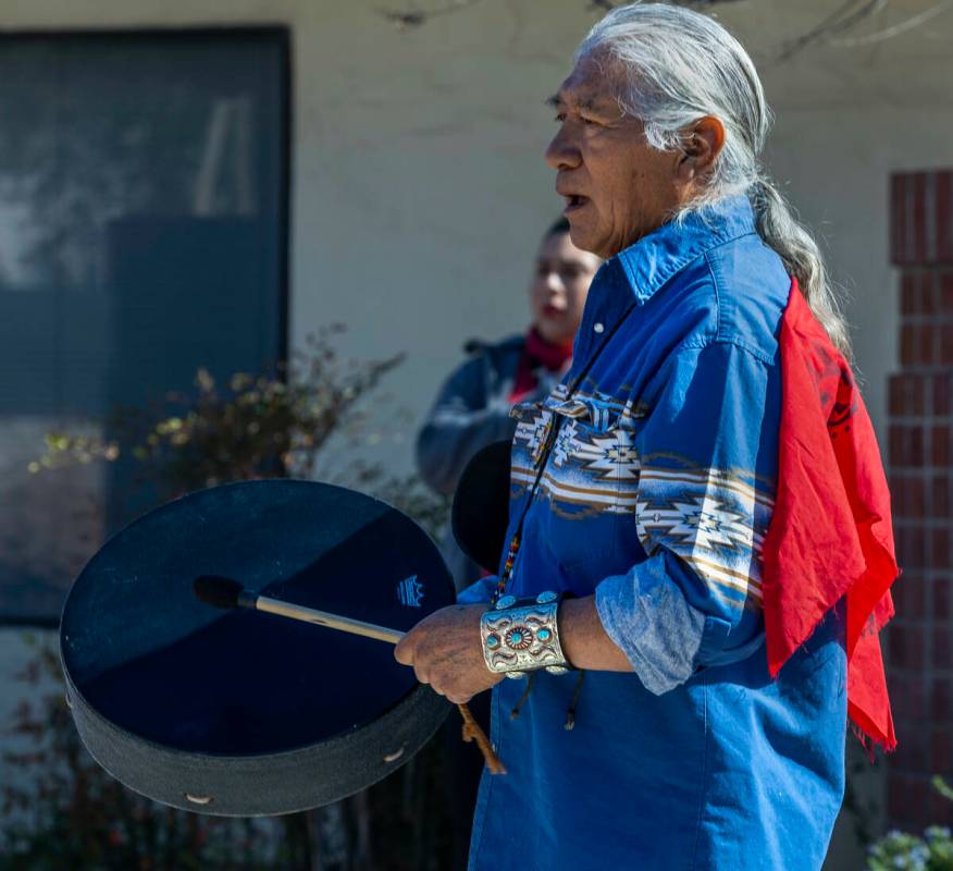 Johnnie Bobb, chief of the Western Shoshone National Council, performs a drum song as members o ...