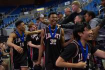 Liberty High School celebrates its win over Bishop Gorman in the NIAA Class 5A boys basketball ...