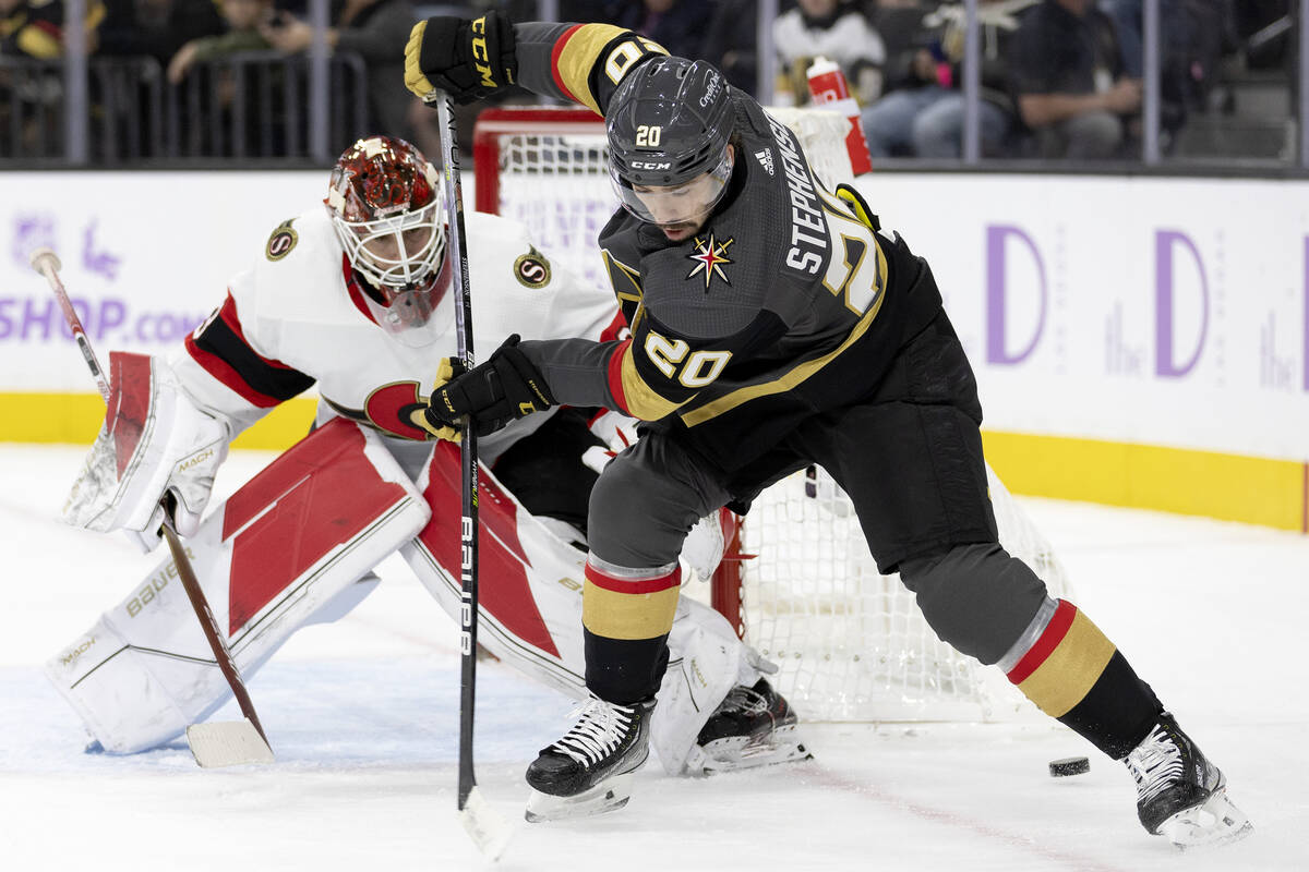 Golden Knights center Chandler Stephenson (20) misses a pass while Senators goaltender Cam Talb ...