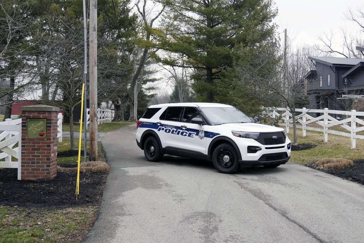 Police secure the entrance to the neighborhood of former Vice President Mike Pence's Indiana ho ...