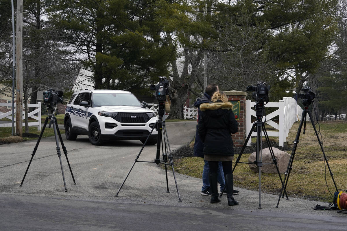 Police secure the entrance to the neighborhood of former Vice President Mike Pence's Indiana ho ...