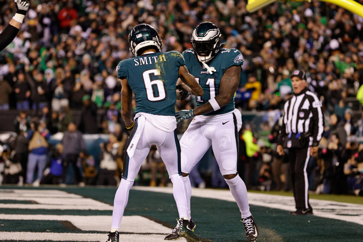 Philadelphia Eagles wide receiver DeVonta Smith (6) celebrates with A.J. Brown (11) after scori ...