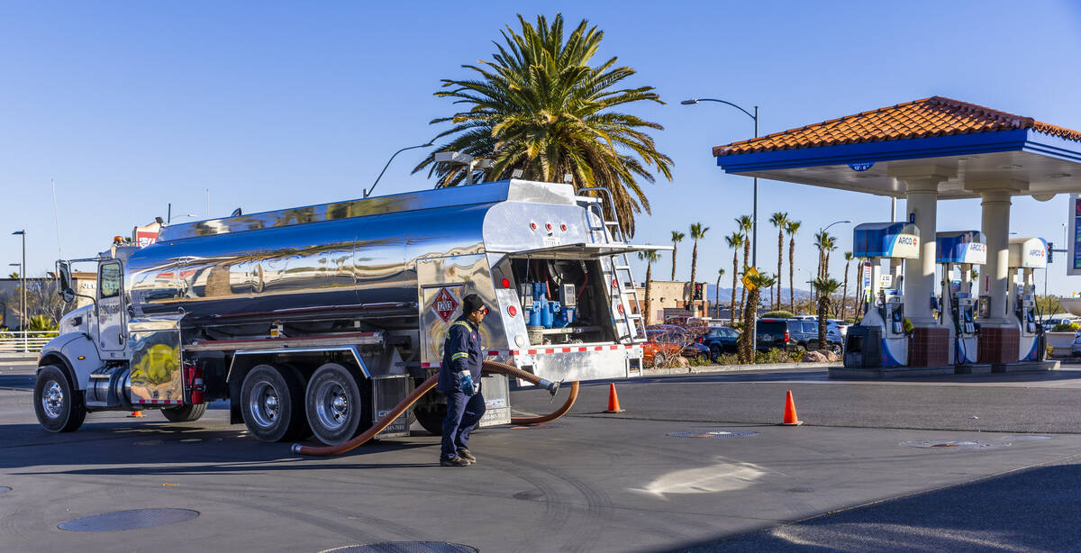 Ignacio Lopez with the Rebel Oil Company fuels up tanks at the Rebel gas station on North Buffa ...