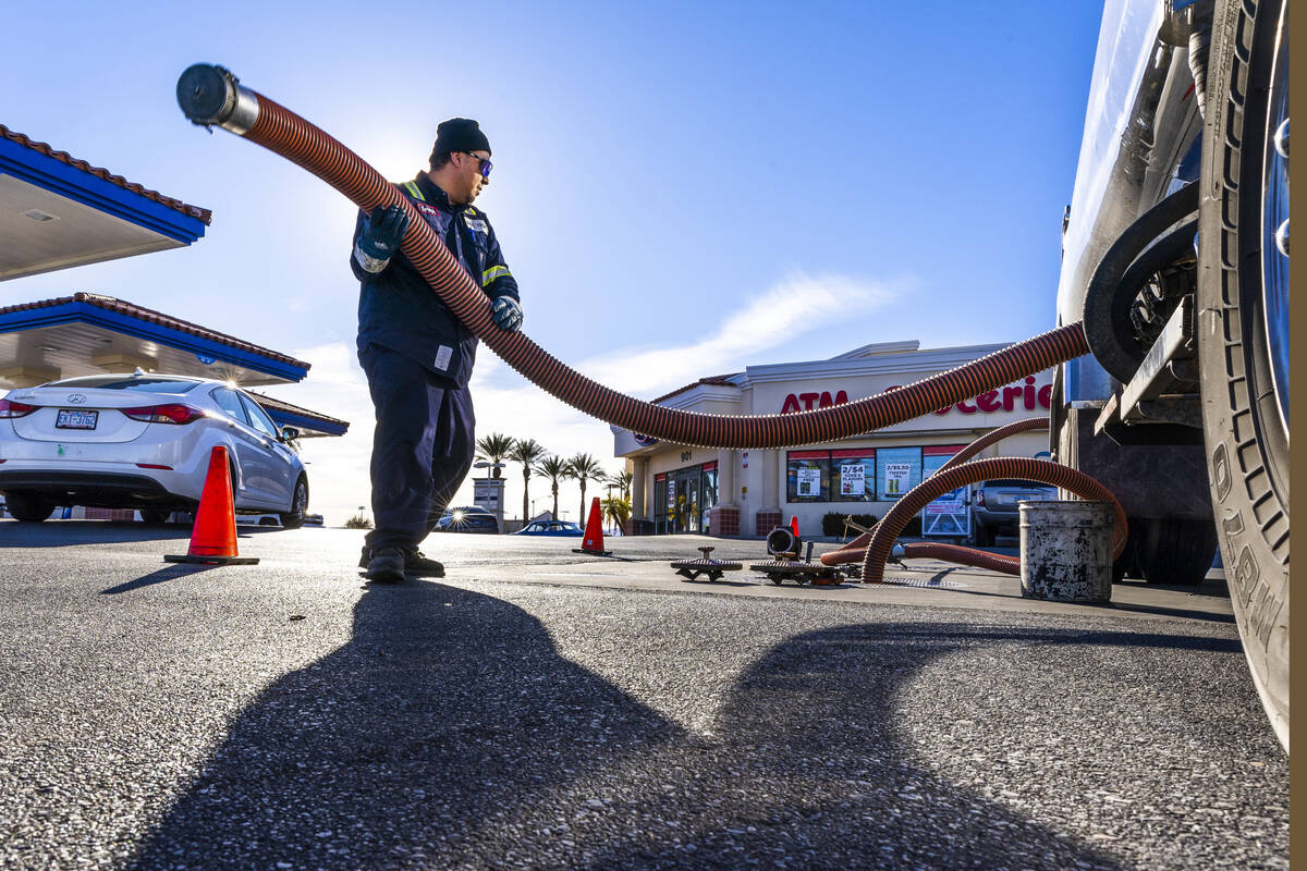 Ignacio Lopez with the Rebel Oil Company fuels up tanks at the Rebel gas station on North Buffa ...