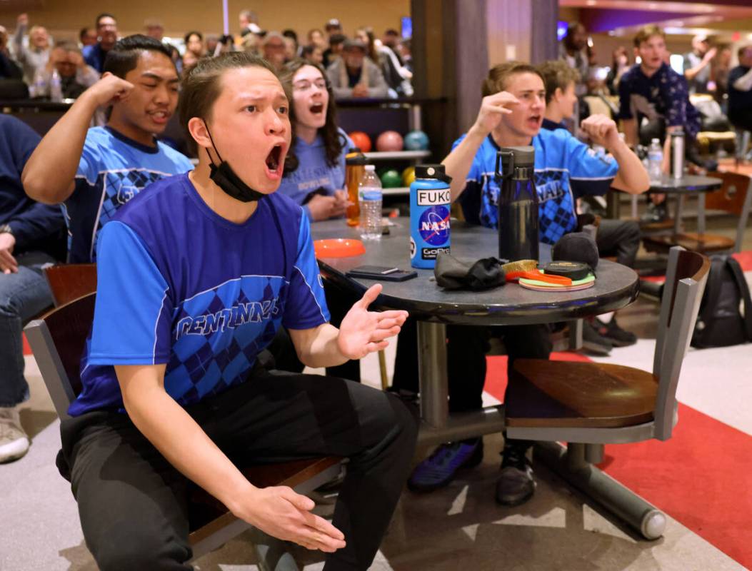 Centennial bowlers, including Dartagnon Longa, front, cheer on their teammate during the Class ...