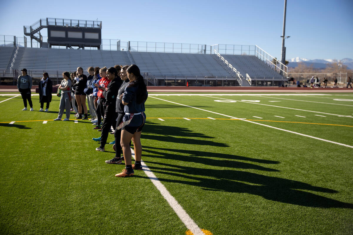 Players participate during a flag football practice at Desert Oasis High School in Las Vegas, T ...