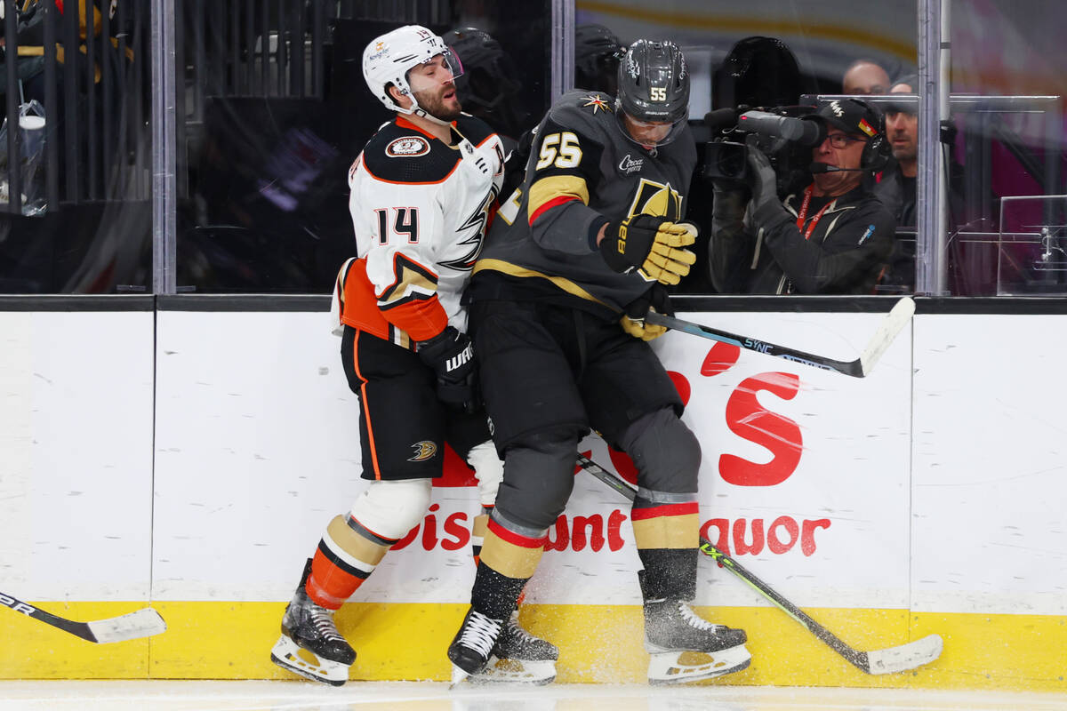 Anaheim Ducks center Adam Henrique (14) and Vegas Golden Knights right wing Keegan Kolesar (55) ...