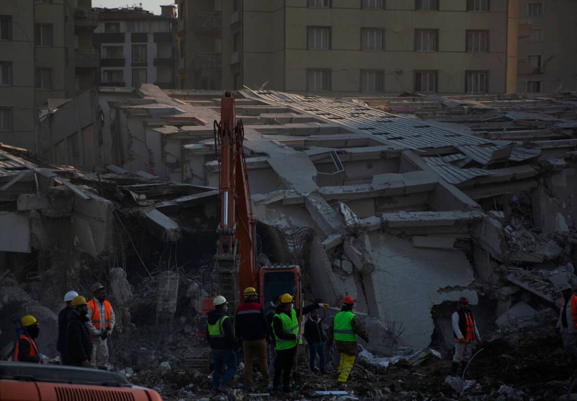 Rescue workers continue the search for victims of the earthquake in Antakya, Turkey, Saturday, ...