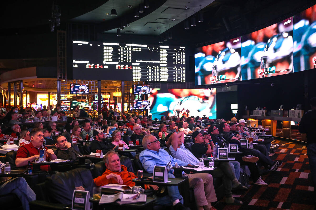 Attendees watch Super Bowl LVII at Caesars Palace sportsbook in Las Vegas, Sunday, Feb. 12, 202 ...