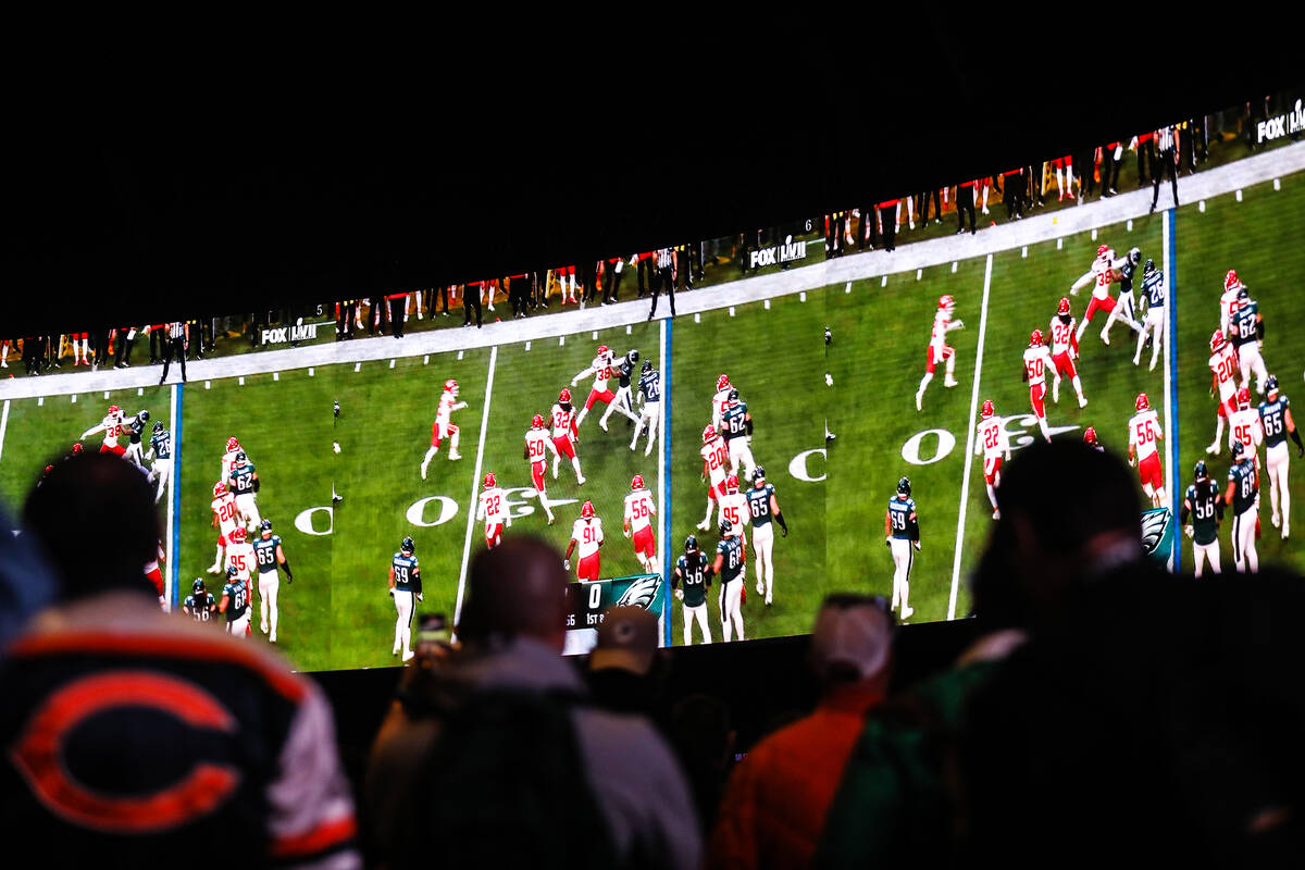 Attendees watch Super Bowl LVII at Caesars Palace sportsbook in Las Vegas, Sunday, Feb. 12, 202 ...