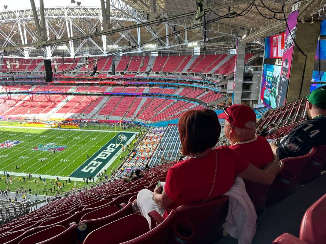 Cindy and Woody Moses look out toward the field at State Farm Stadium in Glendale, Arizona Sund ...