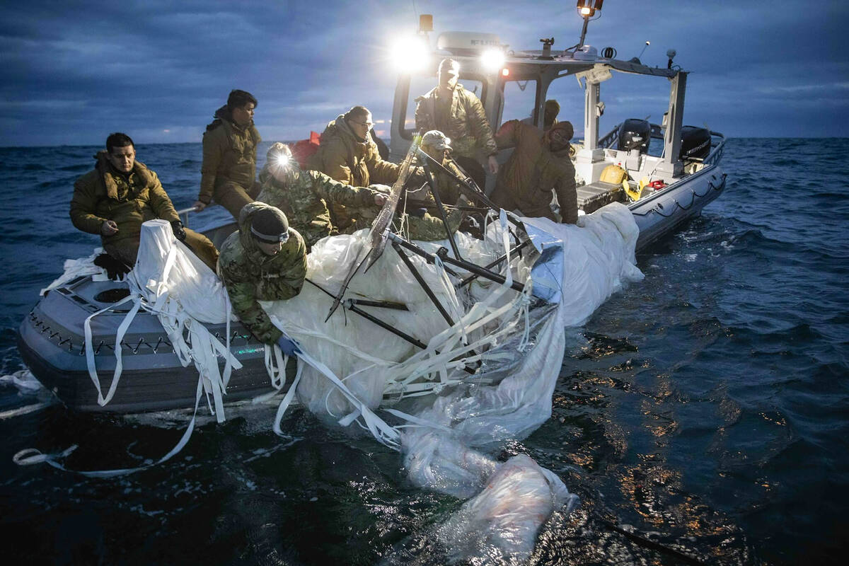 In this photo provided by the U.S. Navy, sailors assigned to Explosive Ordnance Disposal Group ...