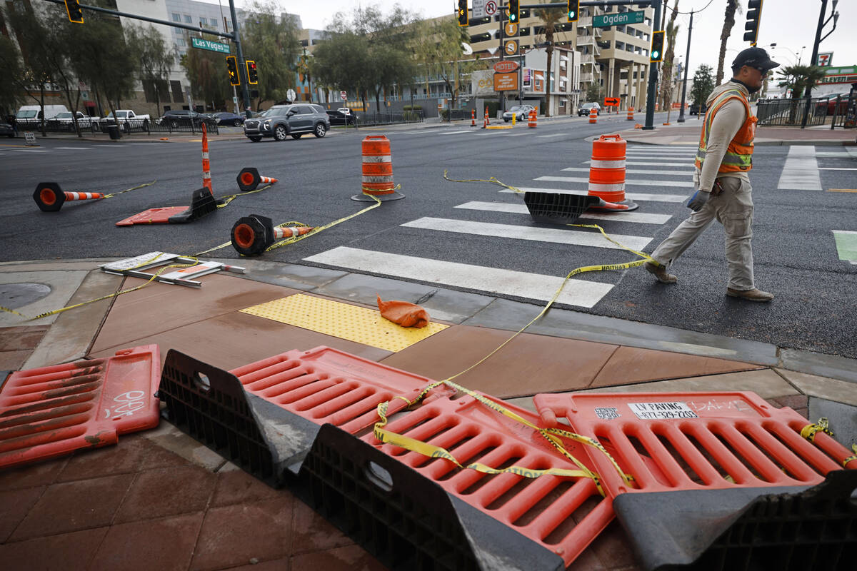 Traffic cones are knocked down by windy weather, Tuesday, Feb. 14, 2023, in downtown Las Vegas. ...