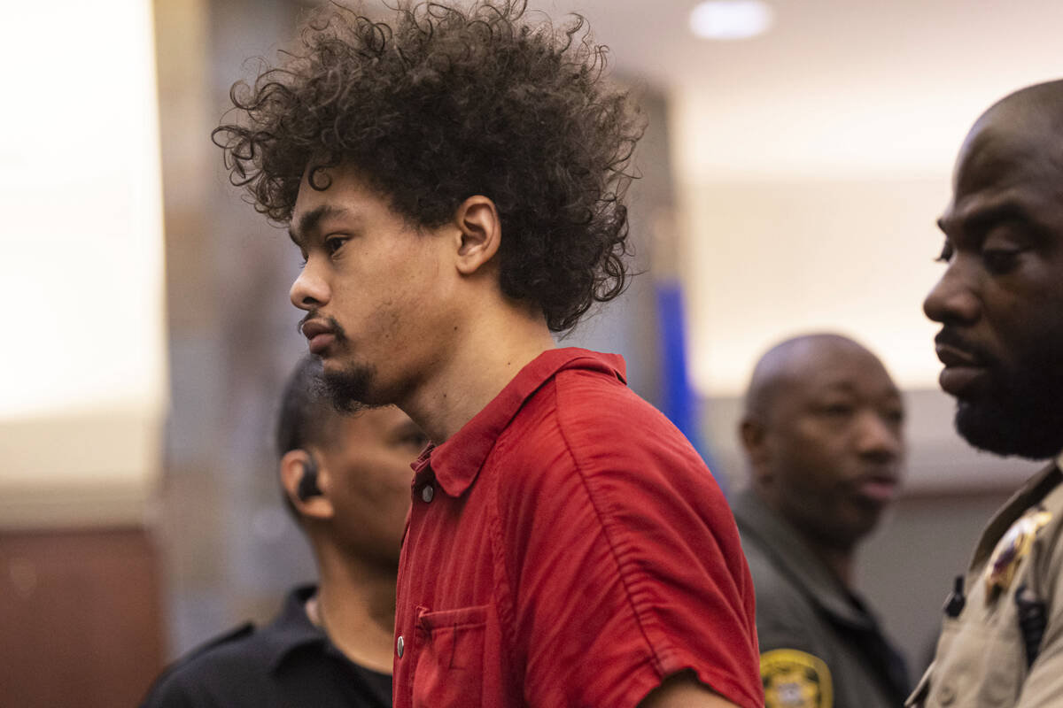 Tyson Hampton, charged in the fatal shooting of Las Vegas police officer Truong Thai, appears i ...