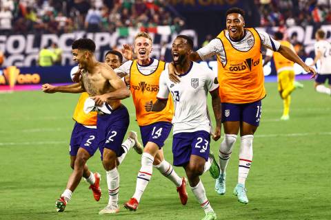 United States players celebrate after defeating Mexico 1-0 in extra time to win the CONCACAF Go ...