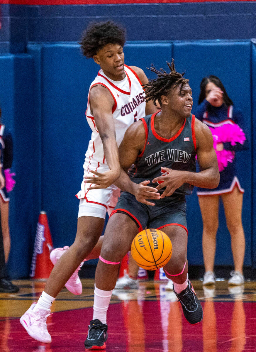 Coronado's Lantz Stephenson (5) slaps the ball away from Arbor View's Brian Townsend (3) lookin ...