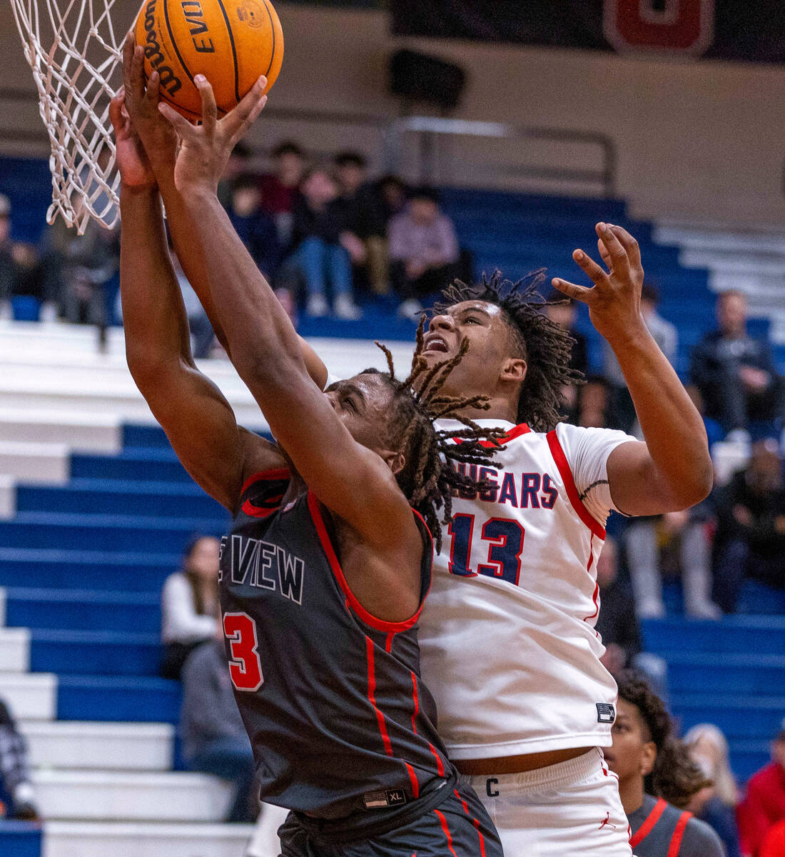 Coronado's Tee Bartlett (13) grabs the ball away from Arbor View's Brian Townsend (3) as he att ...