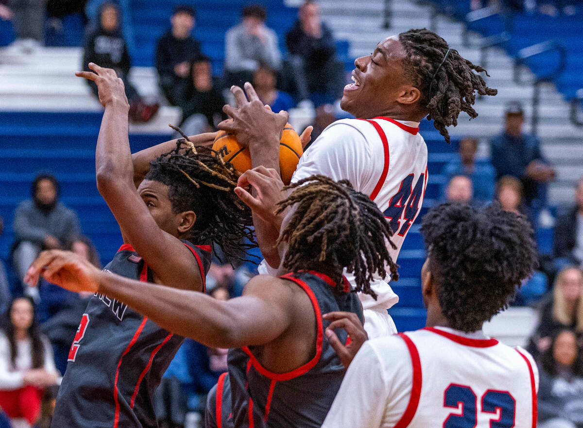 Coronado's Ifiok Peter (44) grabs a rebound away from Arbor View's Sebastian Knox (2) during th ...