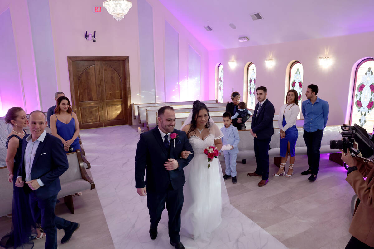 Cristian Sanchez and Juramys Valdes of Las Vegas get married at Vegas Weddings chapel in downto ...