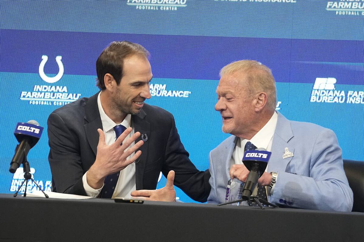 Shane Steichen shakes hand with Indianapolis Colts owner Jim Irsay during a news conference, Tu ...