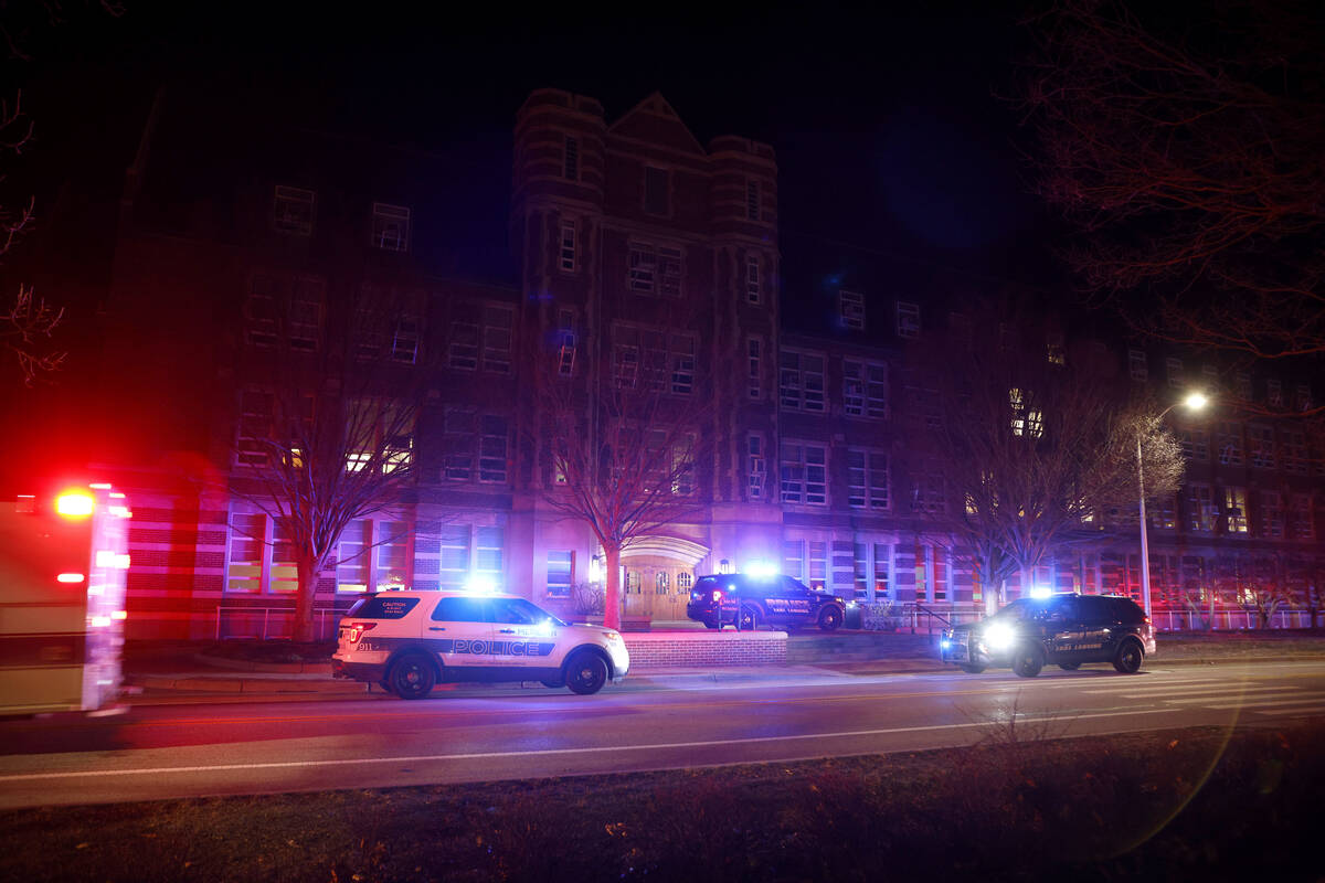 First responders stage outside Berkey Hall following shootings on the campus of Michigan State ...