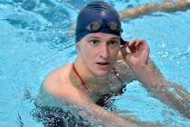 Transgender swimmer Lia Thomas speaks to her coach after winning the 500 meter freestyle during ...