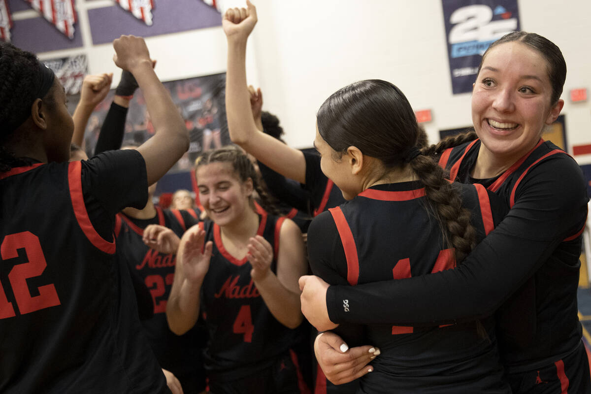 Coronado captain Ashtyn Wick, right, hugs her co-captain Kaylee Walters, second from left, afte ...