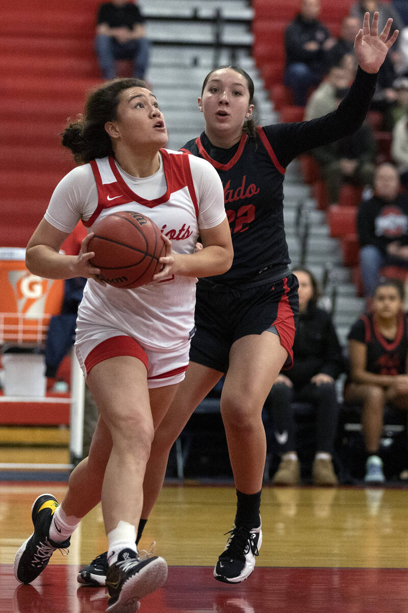 Liberty’s Alia Matavao (22) shoots against Coronado’s Ashtyn Wick (22) during a Class 5A So ...