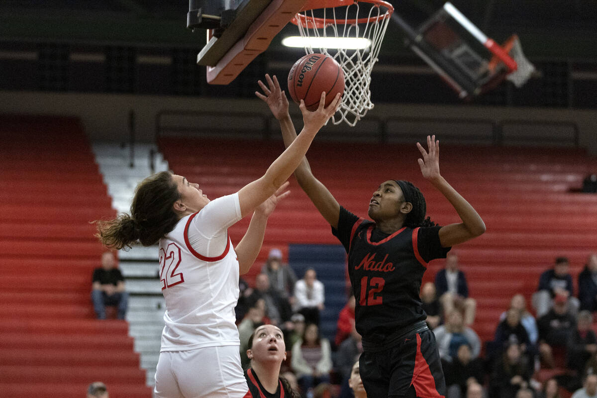 Liberty’s Alia Matavao (22) shoots against Coronado’s Jaila Childress (23) during ...