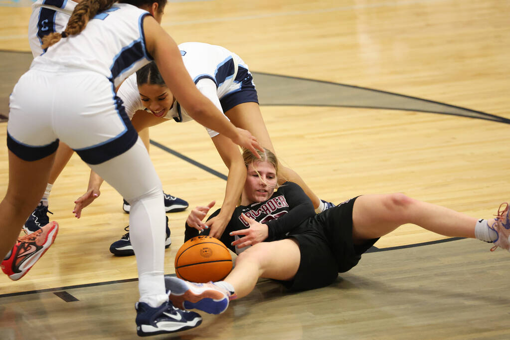 Faith Lutheran's Raina Forgue (23) fights for the ball against Centennial's Charlece Ohiaeri (3 ...