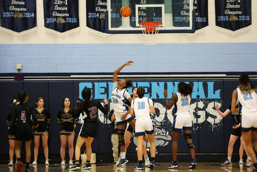 Centennial's Kaliyah Dillard (22) takes a shot for a score against Faith Lutheran during a girl ...