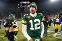 Green Bay Packers' Aaron Rodgers walks off the field after an NFL football game against the Det ...