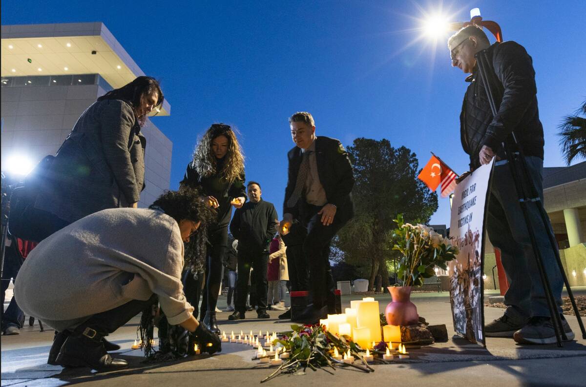 Members of the Turkish community participate in a candlelight vigil to honor and remember the e ...