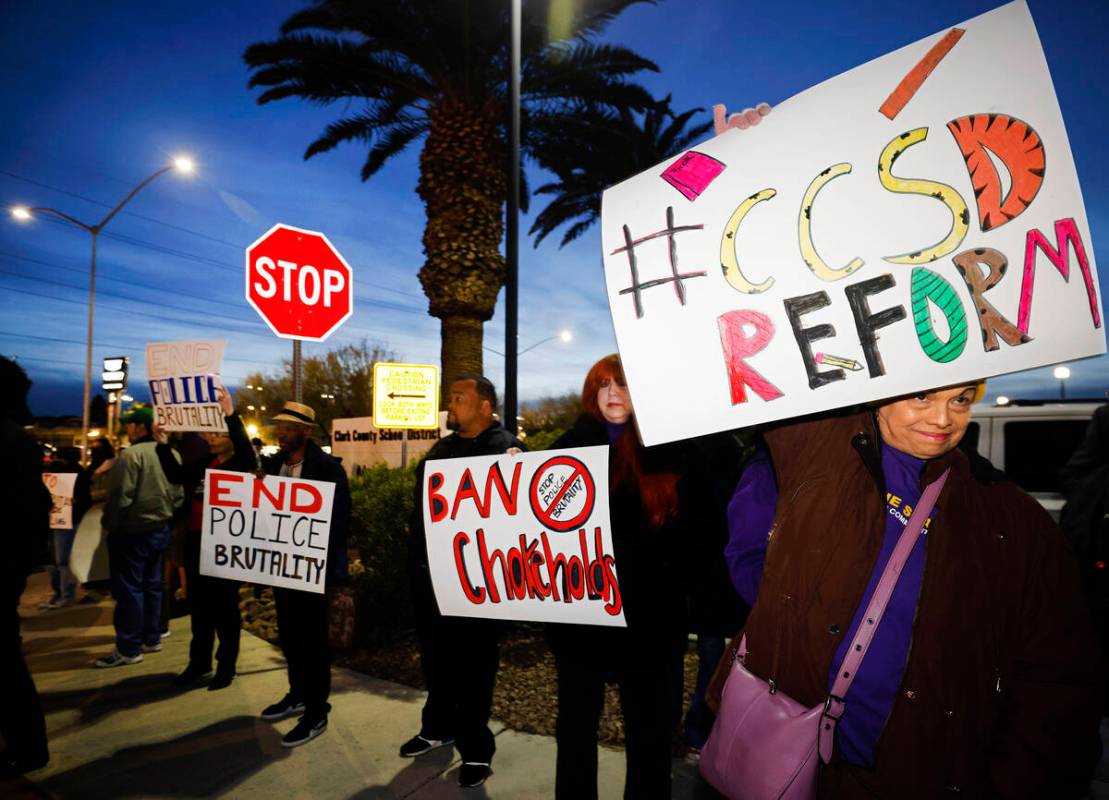 Protesters including union member Lorraine Oliver, right, hold signs outside the Clark County S ...