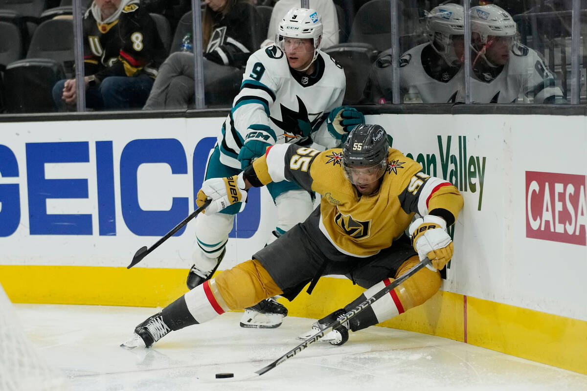 Vegas Golden Knights right wing Keegan Kolesar (55) battle for the puck with San Jose Sharks de ...