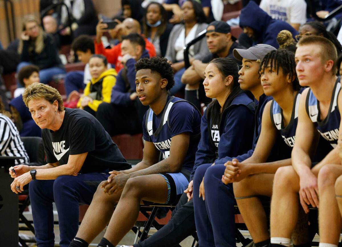 Centennial's head coach Karen Weitz, left, watches her players during the first half of a baske ...