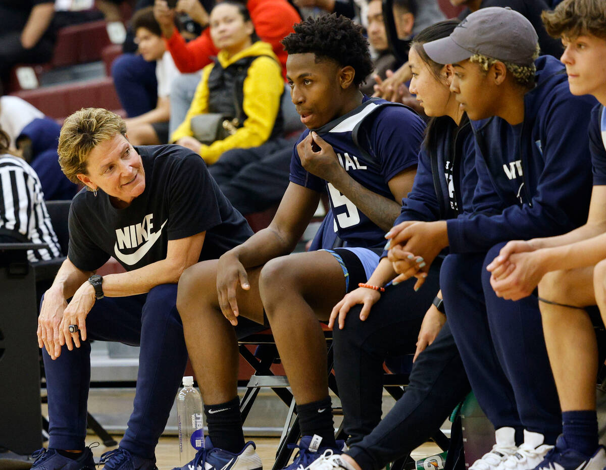 Centennial's head coach Karen Weitz, second from left, talks to her players during the second h ...