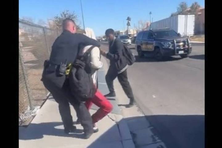 A screenshot of a video showing an incident between a CCSD police officer and someone who appea ...